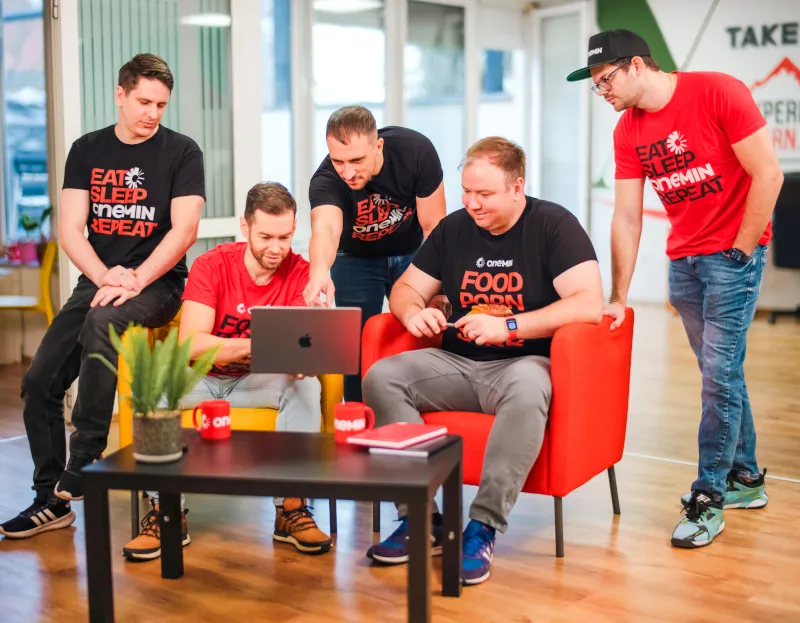 OneMin team collaborating